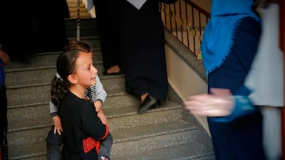 A young girl mourns during the funeral of Maria al-Gazali, a four-month-old Palestinian baby, in Gaza City. . AFP