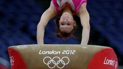 A gymnast performs on the vault during training at the 2012 Summer Olympics on Thursday. AP Photo