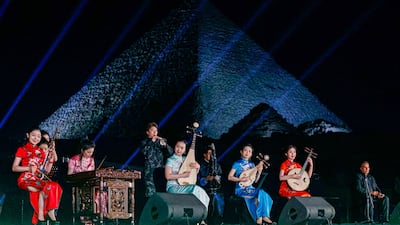 Members of the China National Traditional Orchestra perform in front of the Great Pyramids of Giza, Cairo. AFP