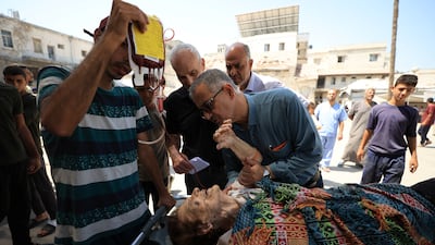 A wounded Christian woman is brought into Al-Ahli Arab Hospital following an Israeli strike on the Church of the Holy Family in Gaza city. Reuters