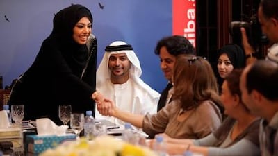 Moza Al Otaiba, one of more than 460 Emiratis seeking election to the FNC, begins her campaign with a press conference at her father's majlis. She said women needed more rights to fulfil roles at home and at work. "They should not need to compromise one for the other."