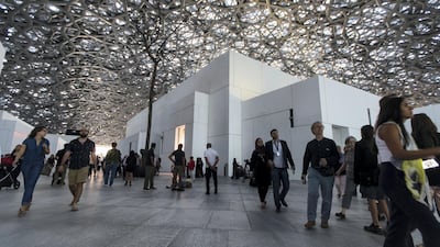 Visitors at the Louvre Abu Dhabi on Saadiyat Island in Abu Dhabi. Tourism in the capital is surging. Christopher Pike / The National