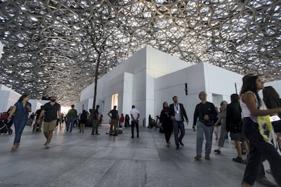 Visitors at the Louvre Abu Dhabi on Saadiyat Island in Abu Dhabi. Tourism in the capital is surging. Christopher Pike / The National