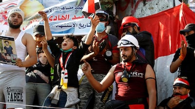 Iraqi demonstrators chant slogans during an ongoing anti-government protest, in Baghdad. Reuters