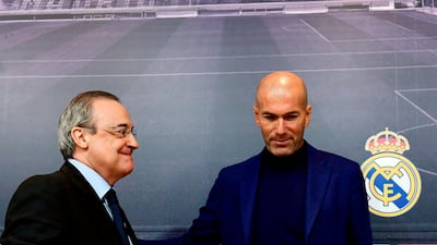 Real Madrid manager Zinedine Zidane, right, stands beside president Florentino Perez, during a press conference to announce his resignation in Madrid on May 31, 2018. Pierre-Philippe Marcou / AFP