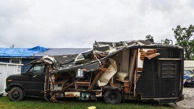 Debris of a van damaged by Hurricane Laura less than 6 weeks ago is seen on the street in Lake Charles, Louisiana on October 8, 2020, a day before Hurricane Delta was expected to hit the southern US state. AFP