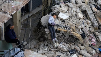 A boy stands amid rubble at the site in the northern city's Bab Al Tabbaneh neighbourhood. Reuters