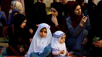 Palestinians attend morning prayers in Khan Younis, Gaza, on Friday. Reuters
