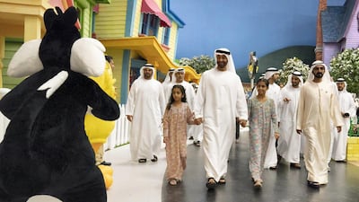 Sheikh Mohammed bin Rashid , Vice President and Ruler of Dubai, and Sheikh Mohammed bin Zayed, Crown Prince of Abu Dhabi and Deputy Supreme Commander of the Armed Forces, who is hand-in-hand with Sheikha Fatima bint Mohammed (L) and Sheikha Salama bint Mohammed (3rd L), attend the opening of Warner Bros World Abu Dhabi. Hamad Al Kaabi / Crown Prince Court - Abu Dhabi