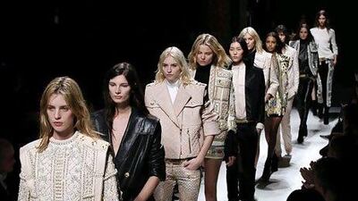 Models present creations by the designer Olivier Rousteing for Balmain. A ripped T-shirt from the French fashion house sells for more than €1,000. AFP