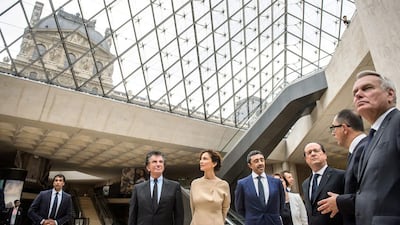 From right: French foreign minister Jean-Marc Ayrault, head of the Louvre museum Jean-Luc Martinez, French president Francois Hollande, Sheikh Abdullah bin Zayed, French culture minister Audrey Azoulay and former French culture minister Jack Lang at the Louvre museum. Christophe Petit Tesson / AFP