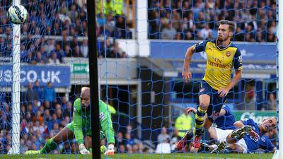 Aaron Ramsey of Arsenal scores his team’s first goal during the Barclays Premier League match between Everton and Arsenal at Goodison Park on August 23, 2014 in Liverpool, England. (Photo by Clive Brunskill/Getty Images)