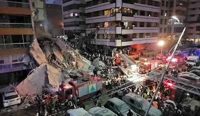 First responders and residents gather at the site of an Israeli air strike in Beirut's Tallet Al Khayyat neighbourhood on April 8, 2026. AFP