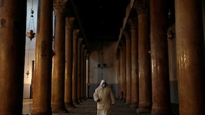 A worshipper walks inside in the Church of the Nativity during Christmas celebrations according to the Eastern Orthodox calendar, in Bethlehem in the Israeli-occupied West Bank. Reuters