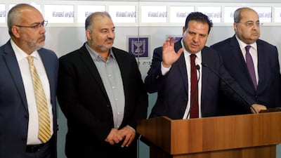 Members of the Joint List Ayman Odeh, center, speaks to the press in the presence of Ahmad Tibi, right, Osama Saadi, left, and Mansour Abbas, second left, following their consulting meeting with Israeli President Reuven Rivlin, in Jerusalem. AP