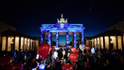 The Brandenburg Gate lit up for a light festival in Berlin, despite being partially dimmed to save energy. EPA