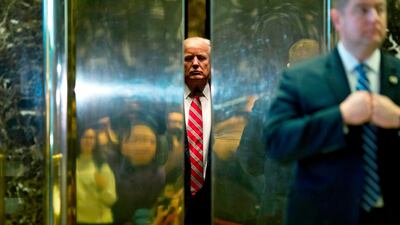 US president Donald Trump boards the elevator after escorting Martin Luther King III to the lobby after meetings at Trump Tower. Dominick Reuter / AFP Photo / January 16, 2017