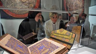 Mrs Macron looks a holy Quran.