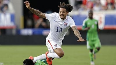 Jermaine Jones, in white, of the United States is tripped up by defender Juwon Oshaniwa of Nigeria during their friendly in Jacksonville. Mike Zarrilli / Getty Images