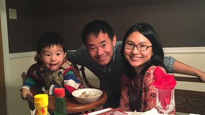 Princeton graduate student Xiyue Wang with his wife and their son before he was detained in Iran in August 2016. AFP