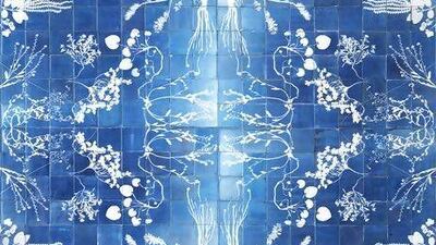 Intricate floral designs are created on Glithero's Blueware tiles when ultraviolet light turns the coating blue. Photo by Petr Krejci