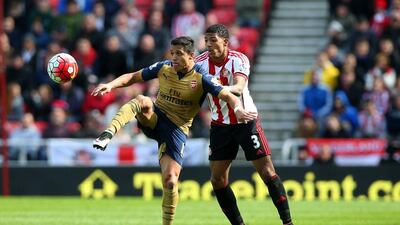 Alexis Sanchez of Arsenal holds off Patrick van Aanholt of Sunderland. Ian MacNicol / Getty Images
