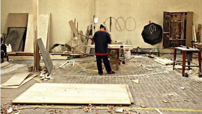 An inmate makes a table in the workshop at the Ras Al Khaimah men's prison.