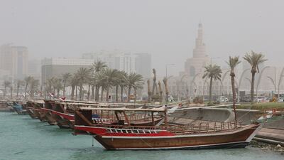 The dhow harbour and the spiral minaret at the mosque of the Abdullah bin Zaid Al Mahmoud Islamic Cultural Centre, in Qatar's capital Doha. AFP