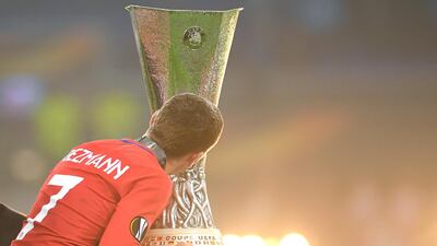 Antoine Griezmann of Atletico Madrid kisses the Europa League trophy after his team's victory in the UEFA Europa League final. Matthias Hangst/Getty Images