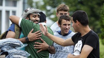 Members of an Etihad Airways delegation deliver blankets and cardigans to residents of the Home for Children and Youth in Sremica, a suburb south of Belgrade.