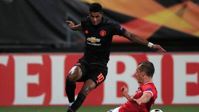 Marcus Rashford is tackled by Stijn Wuytens. Associated Press