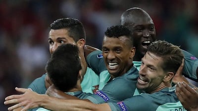 Nani (C) of Portugal celebrates with teammates after scoring the 2-0 lead during the Uefa Euro 2016 semi-final match between Portugal and Wales at Stade de Lyon in Lyon, France, 06 July 2016. Abedin Taherkenareh / EPA