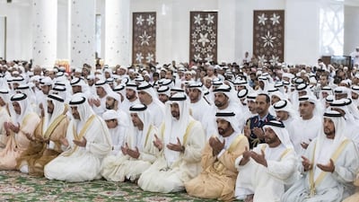 Sheikh Mohammed bin Zayed attends Eid Al Fitr prayers at the Sheikh Zayed Grand Mosque. Also pictured are Sheikh Saif bin Zayed, Deputy Prime Minister and Minister of Interior, Sheikh Hazza bin Zayed, Vice Chairman of the Abu Dhabi Executive Council, Sheikh Nahyan bin Zayed, Chairman of the Board of Trustees of Zayed bin Sultan Al Nahyan Charitable and Humanitarian Foundation, Sheikh Suroor bin Mohammed, Sheikh Saif bin Mohammed, and Sheikh Mohammed Al Hamed. Ryan Carter / Crown Prince Court - Abu Dhabi