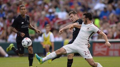 AS Roma midfielder Alessandro Florenzi (24) vies for the ball against Liverpool midfielder James Milner (7) during their friendly match in St Louis, Missouri on August 1, 2016. Michael B Thomas / AFP
