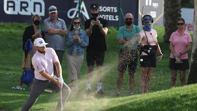 Tyrrell Hatton of England hits his second shot on the 15th hole during the Slync.io Dubai Desert Classic at Emirates Golf Club. Getty