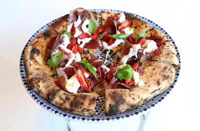The Italiana pizza comes with veal ham and fior di latte cheese. Pawan Singh / The National