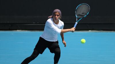 MELBOURNE, AUSTRALIA - JANUARY 23: Meshkatolzahra Safi of Iran plays a forehand in her round one junior girls singles match against Anja Nayar of Australia during day seven of the 2022 Australian Open at Melbourne Park on January 23, 2022 in Melbourne, Australia. (Photo by Mark Metcalfe / Getty Images)