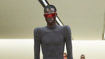 Some men's looks were form-fitted and paired with huge boots