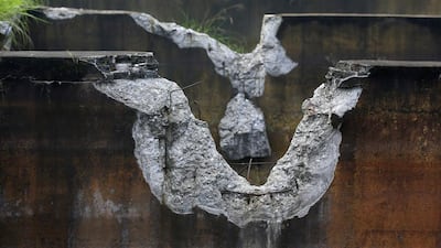 The damaged walls of a cistern are seen at a closed realgar mining plant at Heshan village. Jason Lee / Reuters