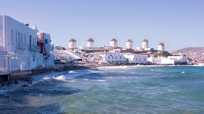 Windmills overlooking the Little Venice area in Mykonos. Photographer: Loulou D'Aki/Bloomberg