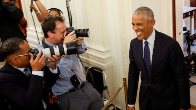 Mr Obama smiles for the camera. Reuters
