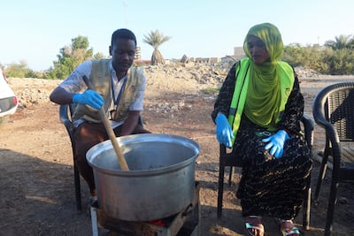 Sudanese volunteers prepare food to break their fast during Ramadan. Reuters