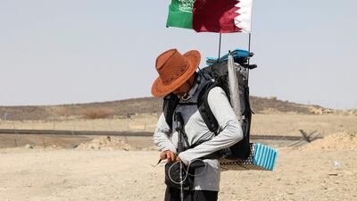 Saudi trekker Abdullah Alsulmi crosses a desert area about 350 kilometres west of Riyadh, on September 27, 2022, during his solo trek to the Qatari capital for the Fifa World Cup. AFP