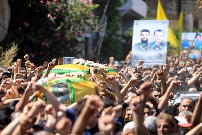 A funeral of two Hezbollah fighters in a southern Lebanese village near the border with northern Israel last month. An all-out Lebanon-Israel war could draw Iran in, which could then spiral into a regional conflict. AFP