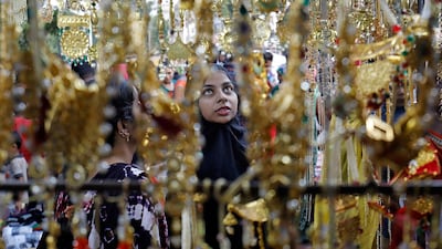 Women buy artificial jewellery and decorative items at a market ahead of Diwali, the Hindu festival of lights, in Ahmedabad, India, October 18, 2019. Reuters