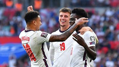 England's Bukayo Saka, right, celebrates scoring England's fourth goal. Reuters