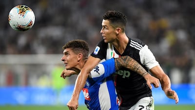 Cristiano Ronaldo tussles with Giovanni Di Lorenzo. Reuters