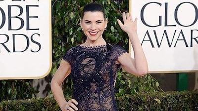 Julianna Margulies offsets a reeky low back with a high neck and cap sleeves. Jason Merritt / AFP