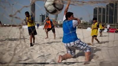 Abu Dhabi’s beach sport park is one place for youngsters to spend some time, if the weather plays fair and not foul. Andrew Henderson / The National