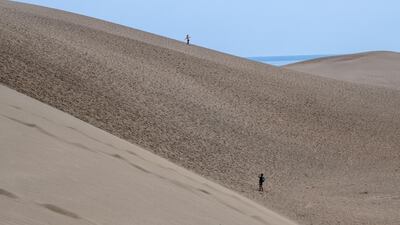 People visit Tottori Sand Dunes in Tottori, Japan. Getty